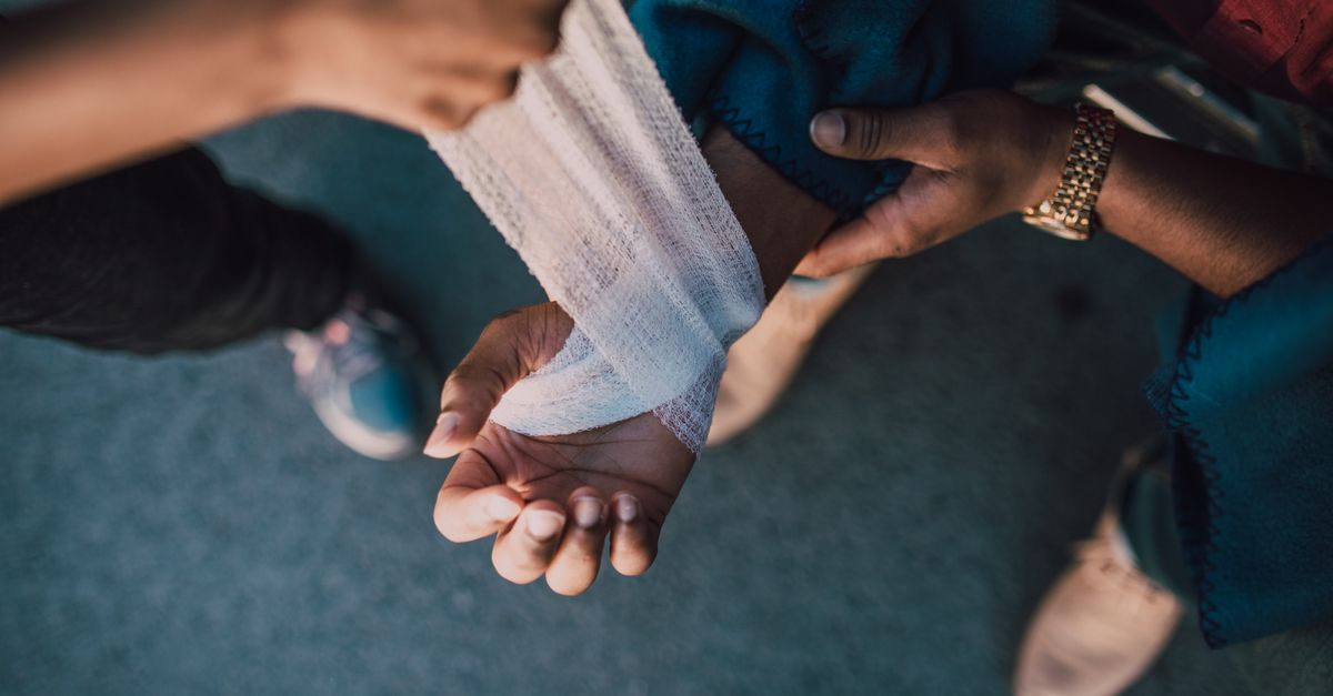 First aid bandage applied to a wrist in the backcountry