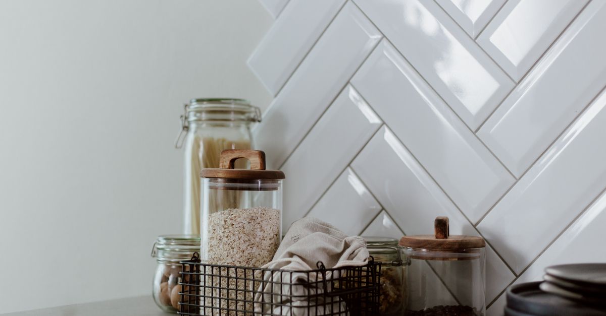Store long-term food provisions, jars and containers organized on a pantry shelf